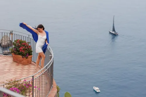 proposal-photographer-taormina-cliffside-terrace-portrait.webp