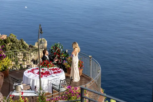 proposal-taormina-la-rotonda-sul-mare-woman-terrace-view.webp