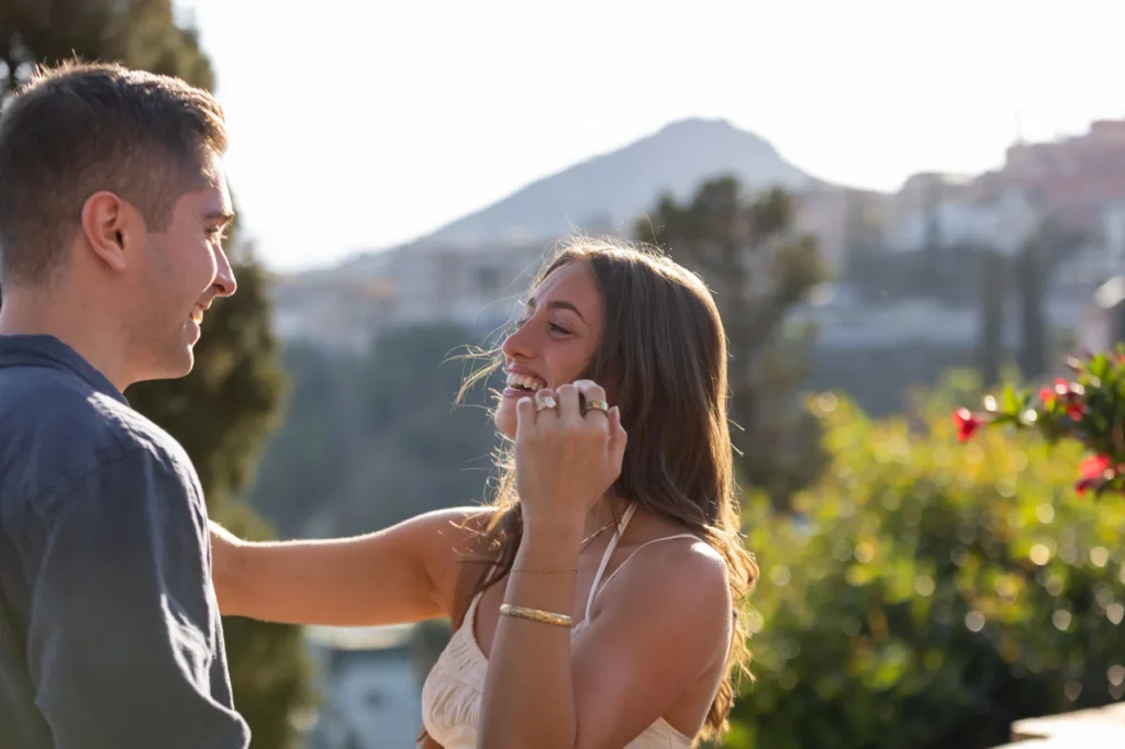 Surprise proposal reaction in Taormina public gardens