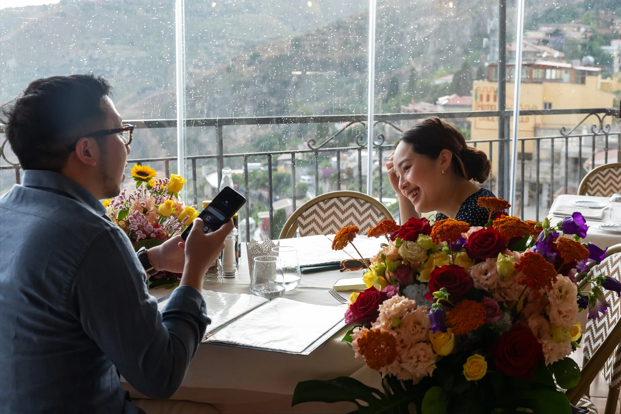 proposal Al Saraceno Taormina rainy day restaurant Etna view hidden photographer