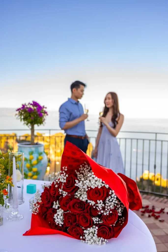 romantic proposal Taormina Isola Bella sea view couple after yes