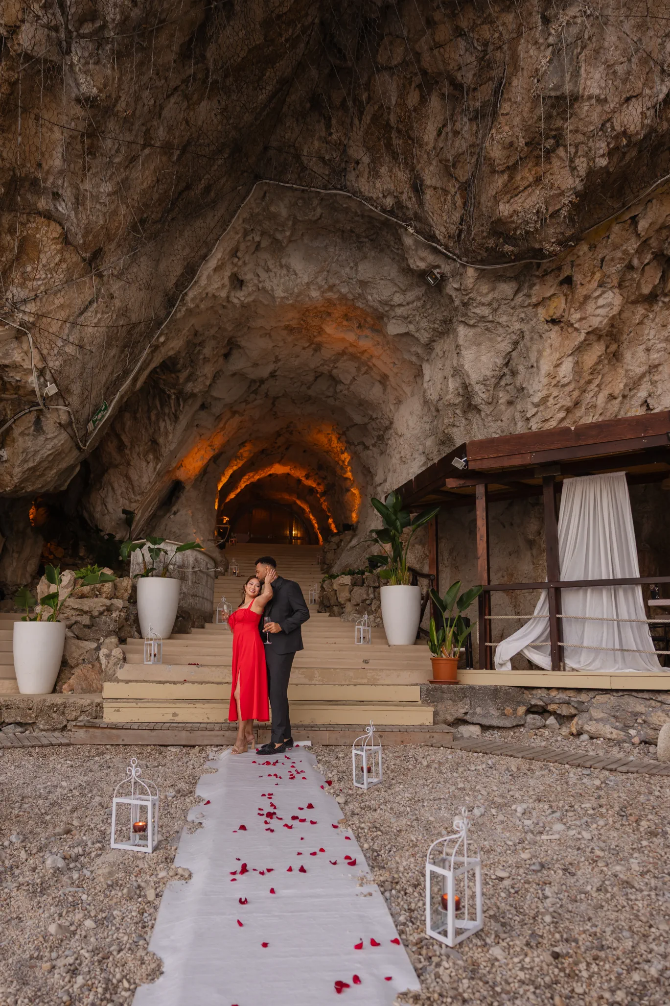 couple walking through the grotto at Capotaormina