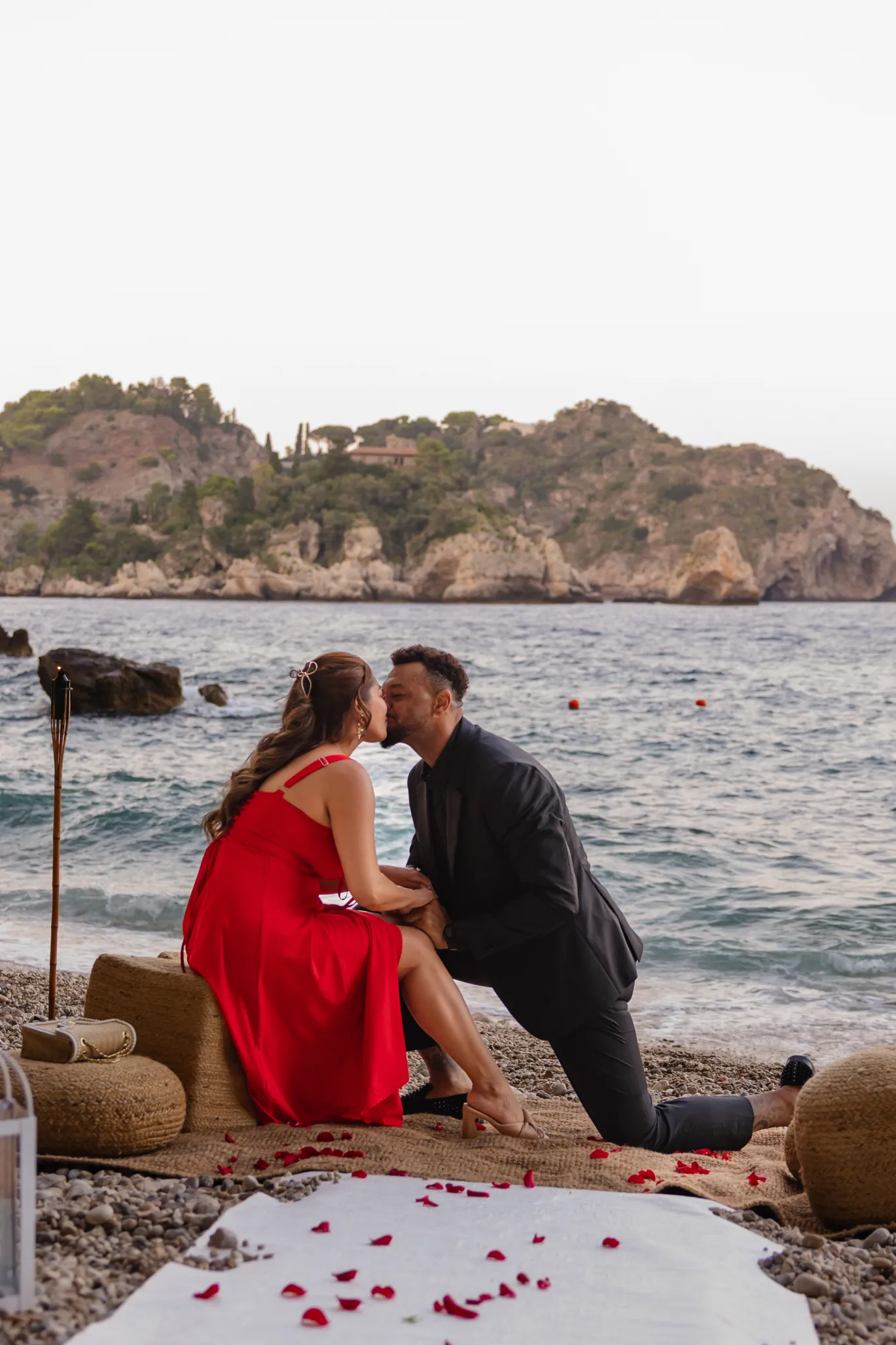 close up kiss after private beach proposal in Taormina